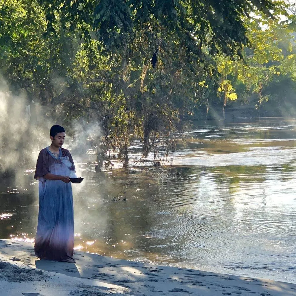 Saging by the river in soft golden light